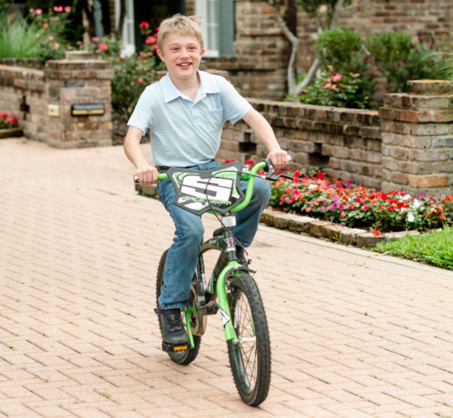 Lee rides a bike.